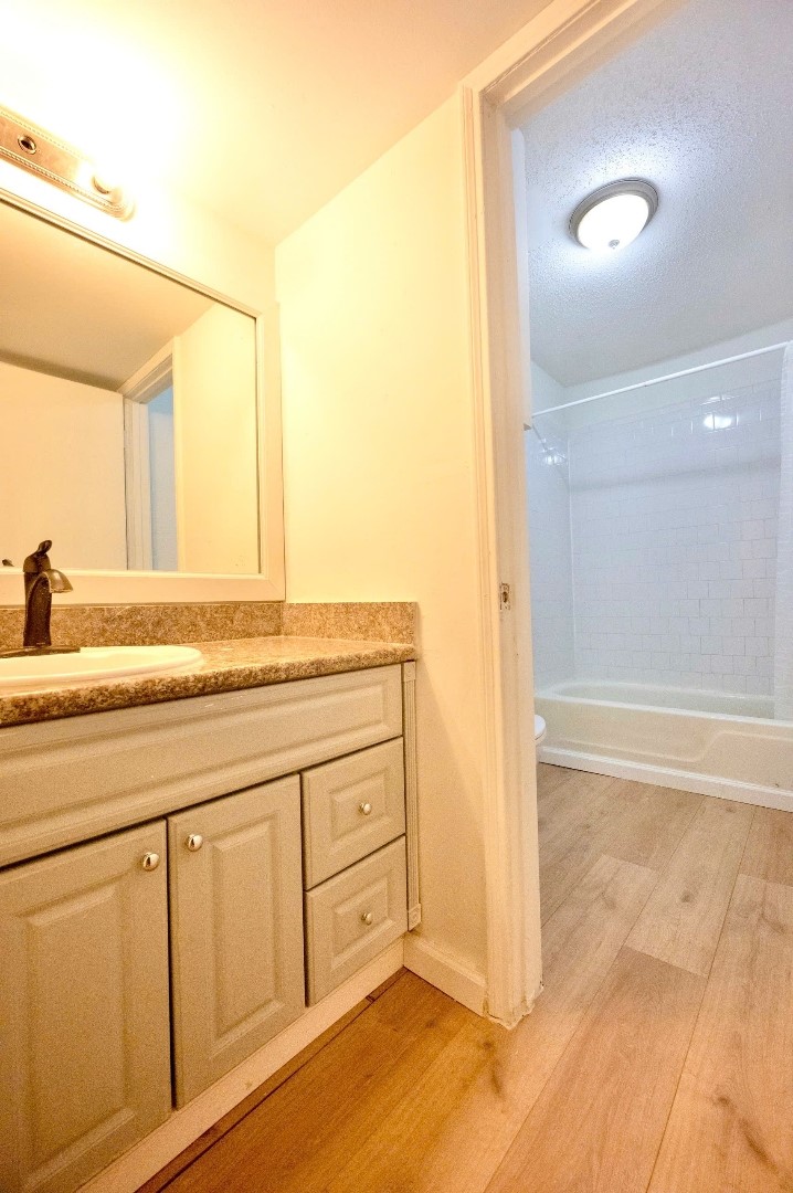 12048 Beechnut Street Houston, TX 77072 - Photo 7 of 21 a bathroom with a granite countertop sink and a mirror