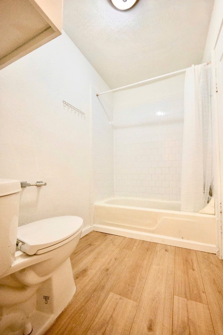 12048 Beechnut Street Houston, TX 77072 - Photo 10 of 21 a bathroom with a toilet and a shower