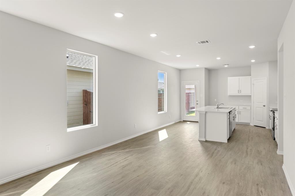 1702 Potomac Lane Blue Ridge, TX 75424 - Photo 7 of 27 a view of a kitchen with furniture and wooden floor