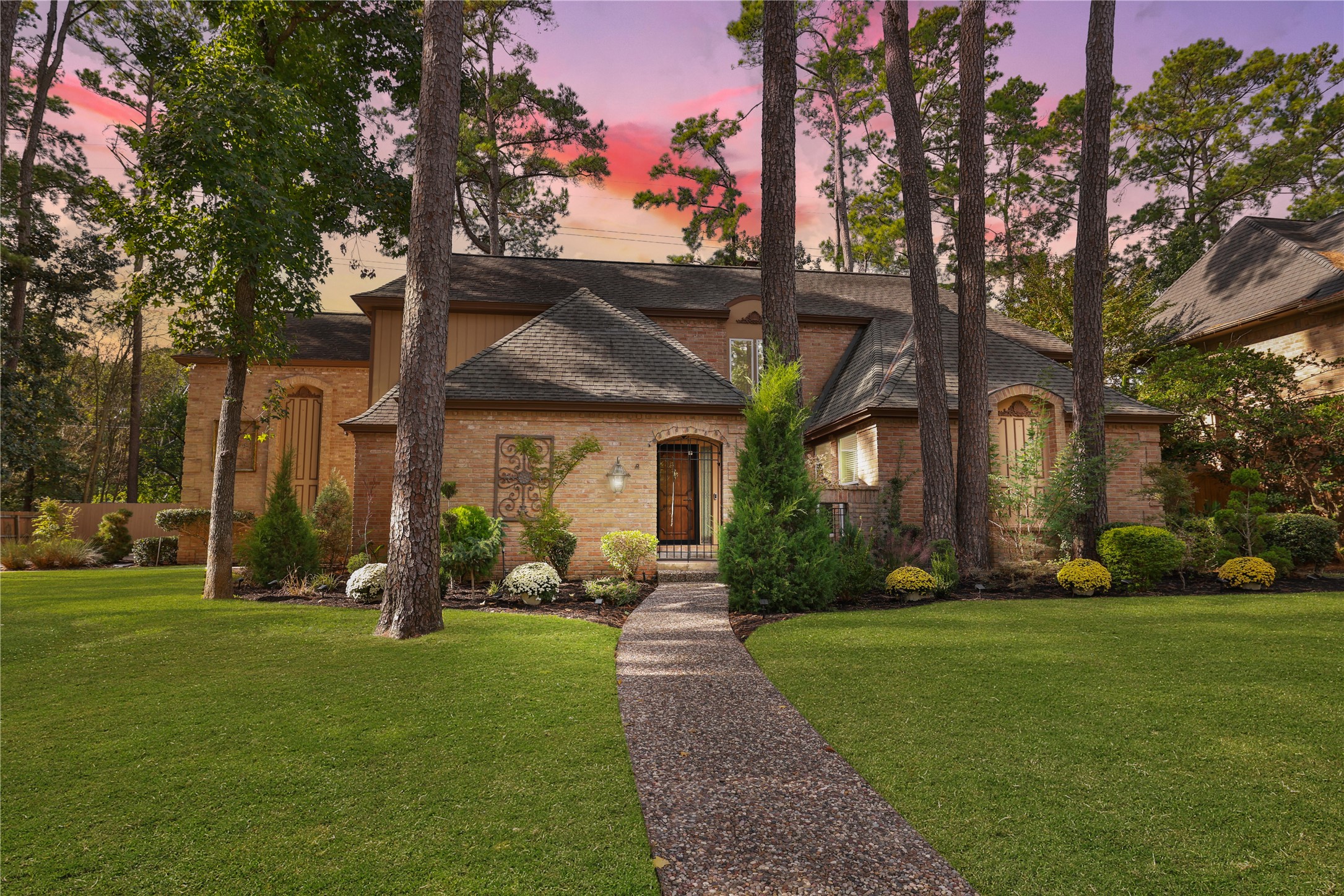 16123 Chasemore Drive Spring, TX 77379 - Photo 2 of 50 This charming brick home built by Ernest Roe features classic architecture and lush landscaping.