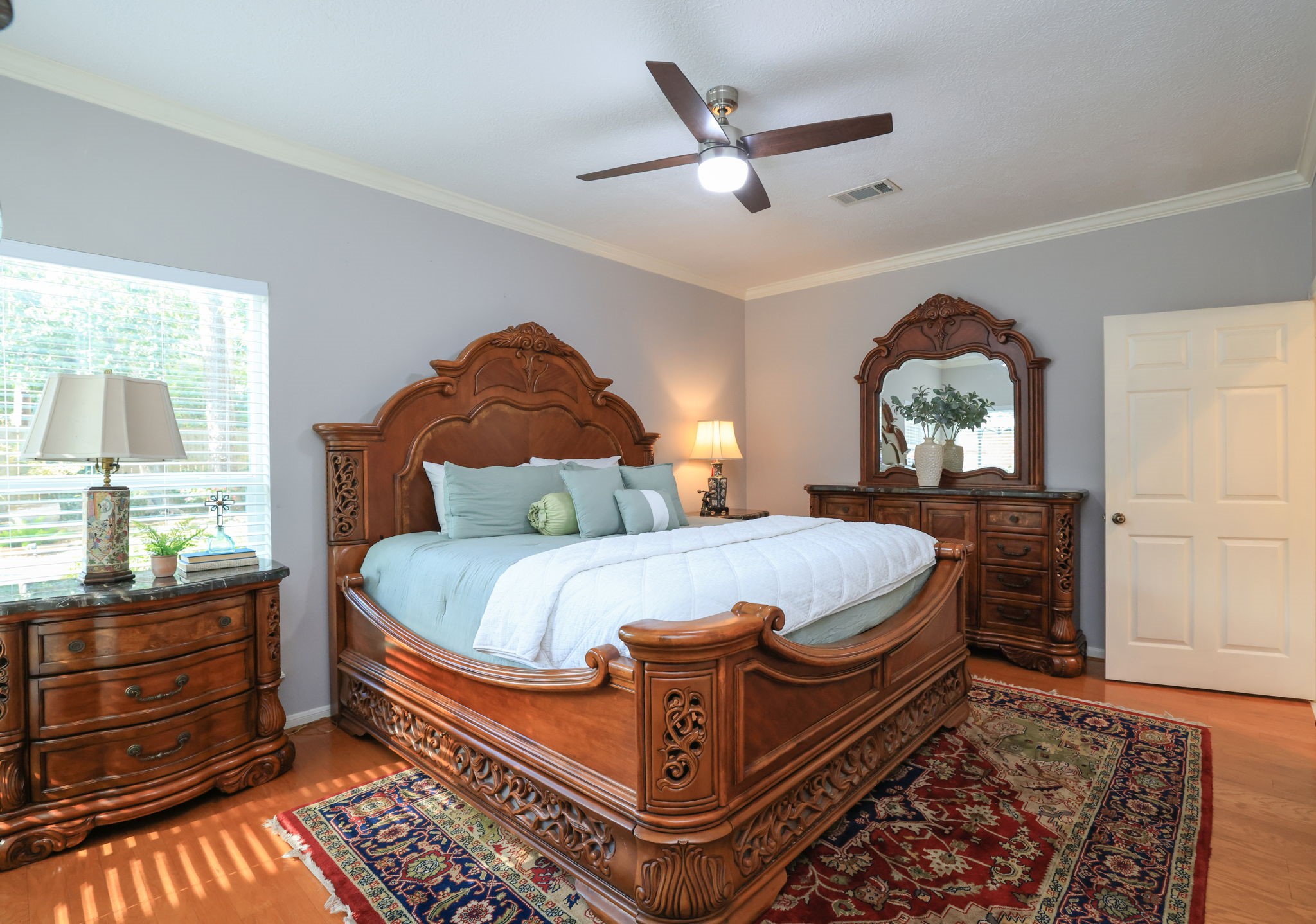 16123 Chasemore Drive Spring, TX 77379 - Photo 28 of 50 This second bedroom down, hardwood floors and ceiling fan with an ensuite full bathroom.