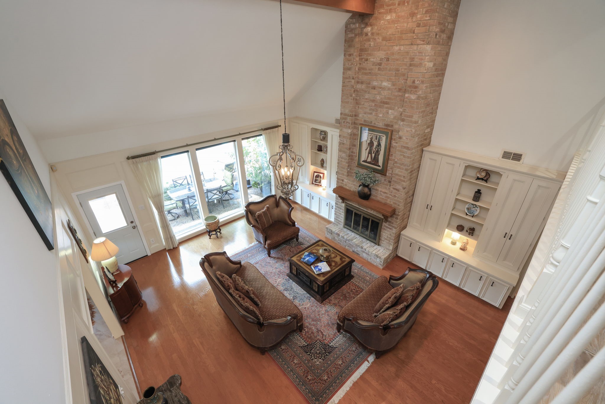 16123 Chasemore Drive Spring, TX 77379 - Photo 32 of 50 This view from the second floor catwalk is looking down to the two story living area.