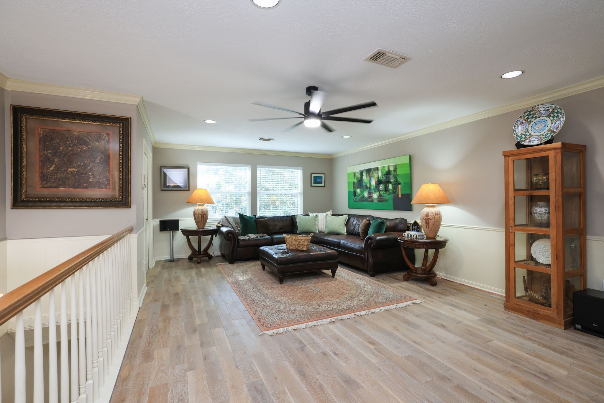 16123 Chasemore Drive Spring, TX 77379 - Photo 36 of 50 This inviting second floor game room features warm wood flooring, and plenty of natural light from large windows. The stairs to the left lead to the laundry room.