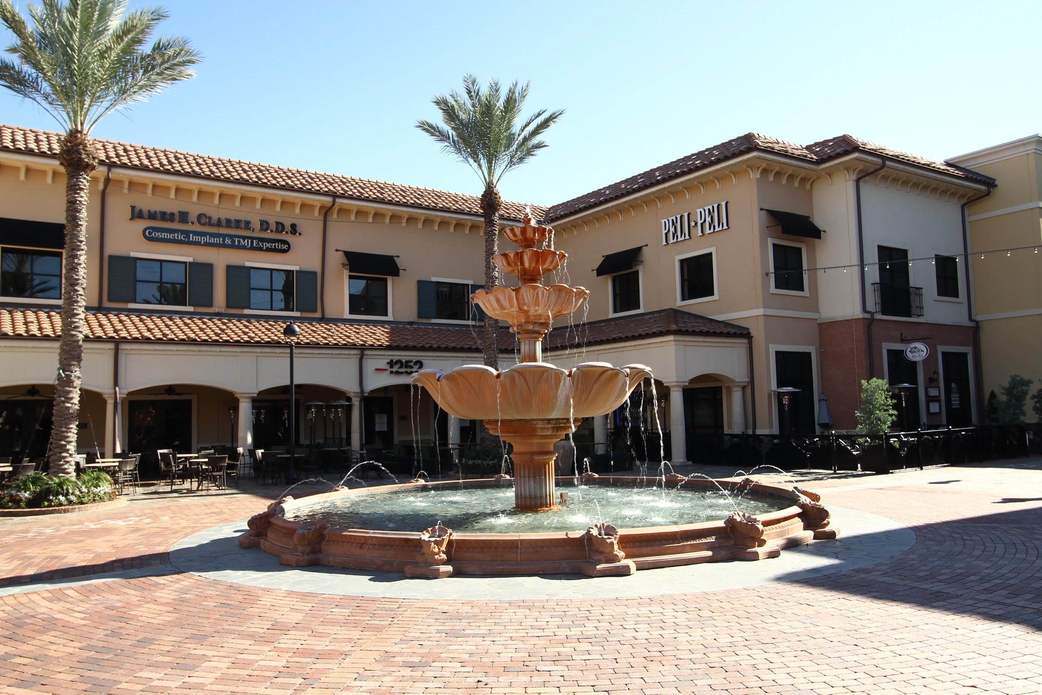 16123 Chasemore Drive Spring, TX 77379 - Photo 48 of 50 This photo showcases the Vintage Park plaza with a central fountain, surrounded by Mediterranean-style shops and restaurants modeled after an Italian shopping center.