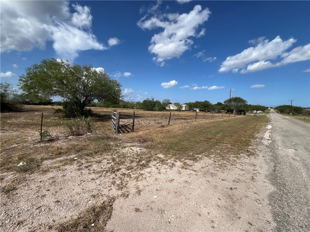 310 Cr Orange Grove, TX 78372 - Photo 22 of 32 a view of a lake with houses in the back