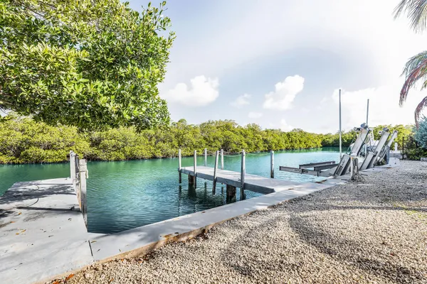 a view of a house with a tree in front
