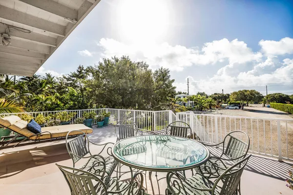 a terrace with outdoor seating and city view
