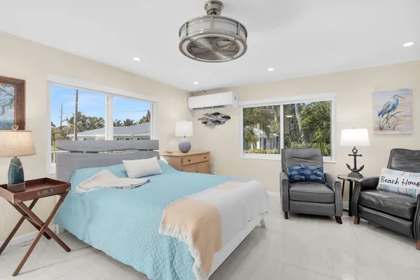 a large bedroom with furniture and fireplace