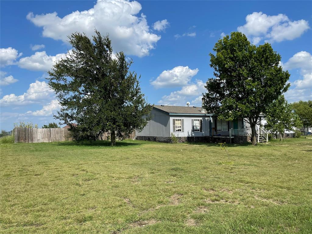 1100 Pecan Ridge Drive Venus, TX 76084 - Photo 3 of 13 View of yard with covered porch