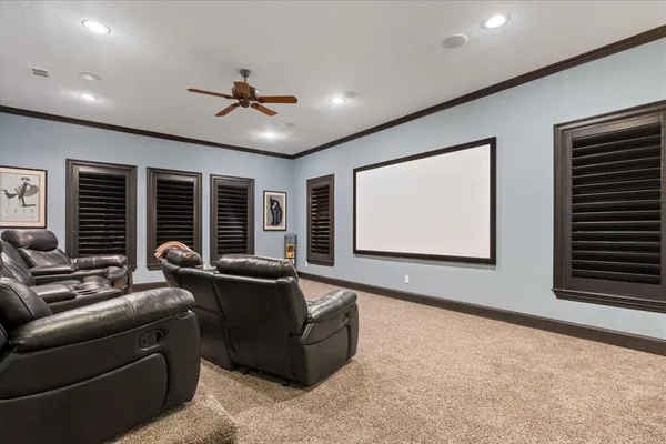 a living room with furniture a projector and a flat screen tv