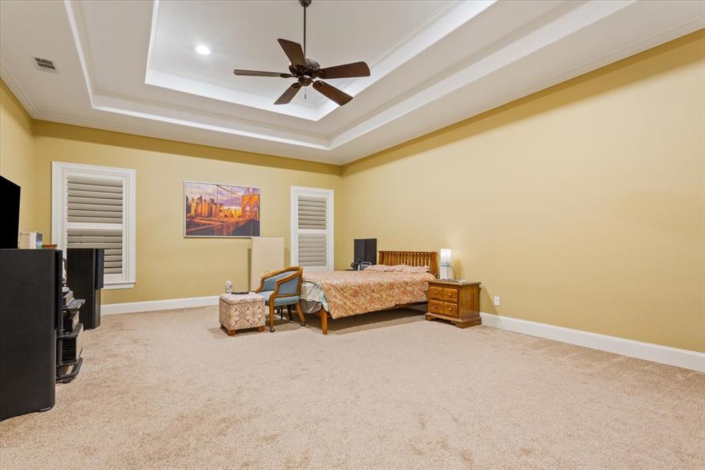10020 Hidden Bluff Waco, TX 76657 - Photo 24 of 40 a bedroom with a bed furniture and a ceiling fan