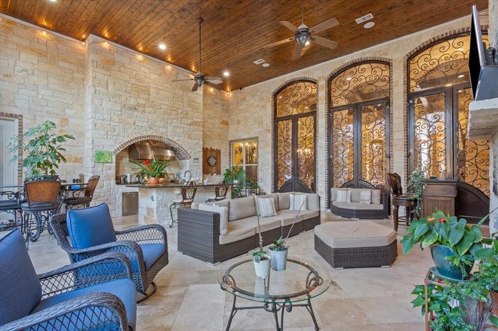 10020 Hidden Bluff Waco, TX 76657 - Photo 34 of 39 a living room with furniture fireplace and potted plants