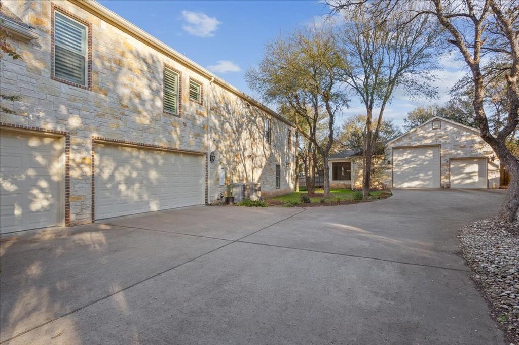 10020 Hidden Bluff Waco, TX 76657 - Photo 37 of 39 a backyard of a building with large trees