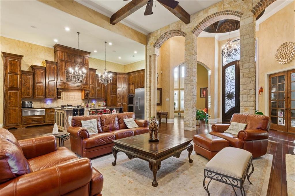 10020 Hidden Bluff Waco, TX 76657 - Photo 5 of 39 a living room with furniture and a chandelier
