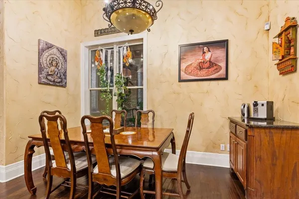 a view of a dining room with furniture and window