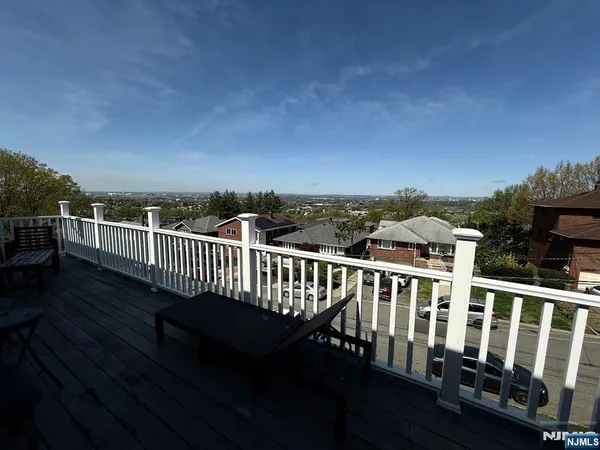 a view of a balcony with wooden floor