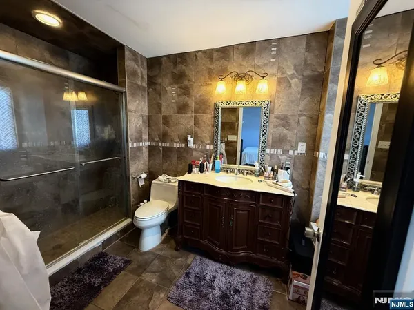 a bathroom with a double vanity sink and a mirror
