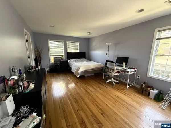 a bedroom with furniture and a window