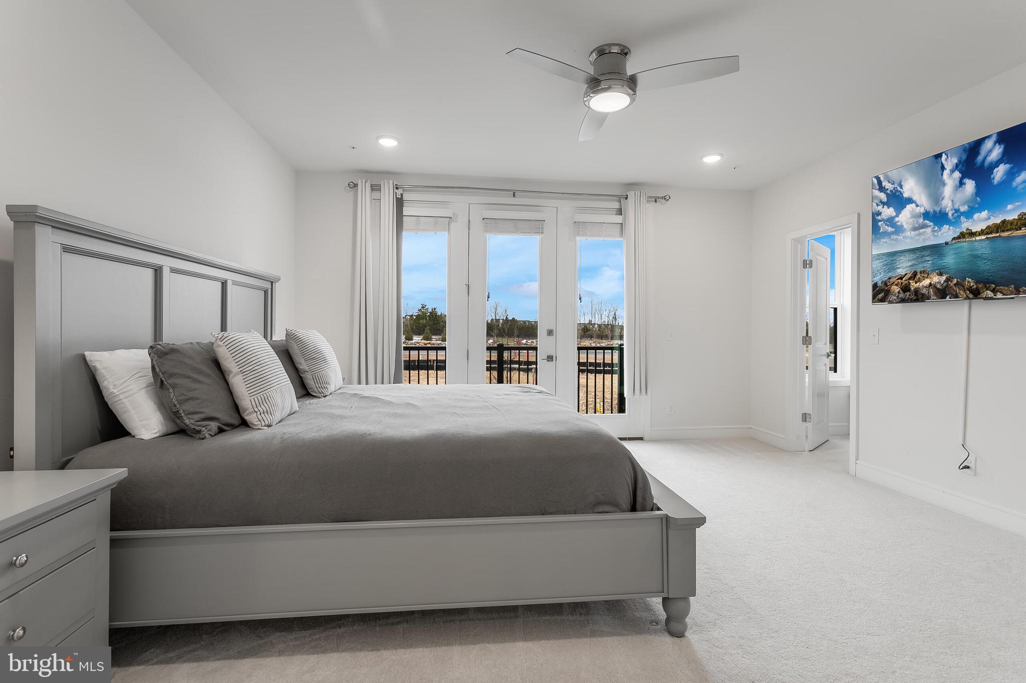 42708 Darala Drive Ashburn, VA 20147 - Photo 14 of 27 a bedroom with a large bed and a window