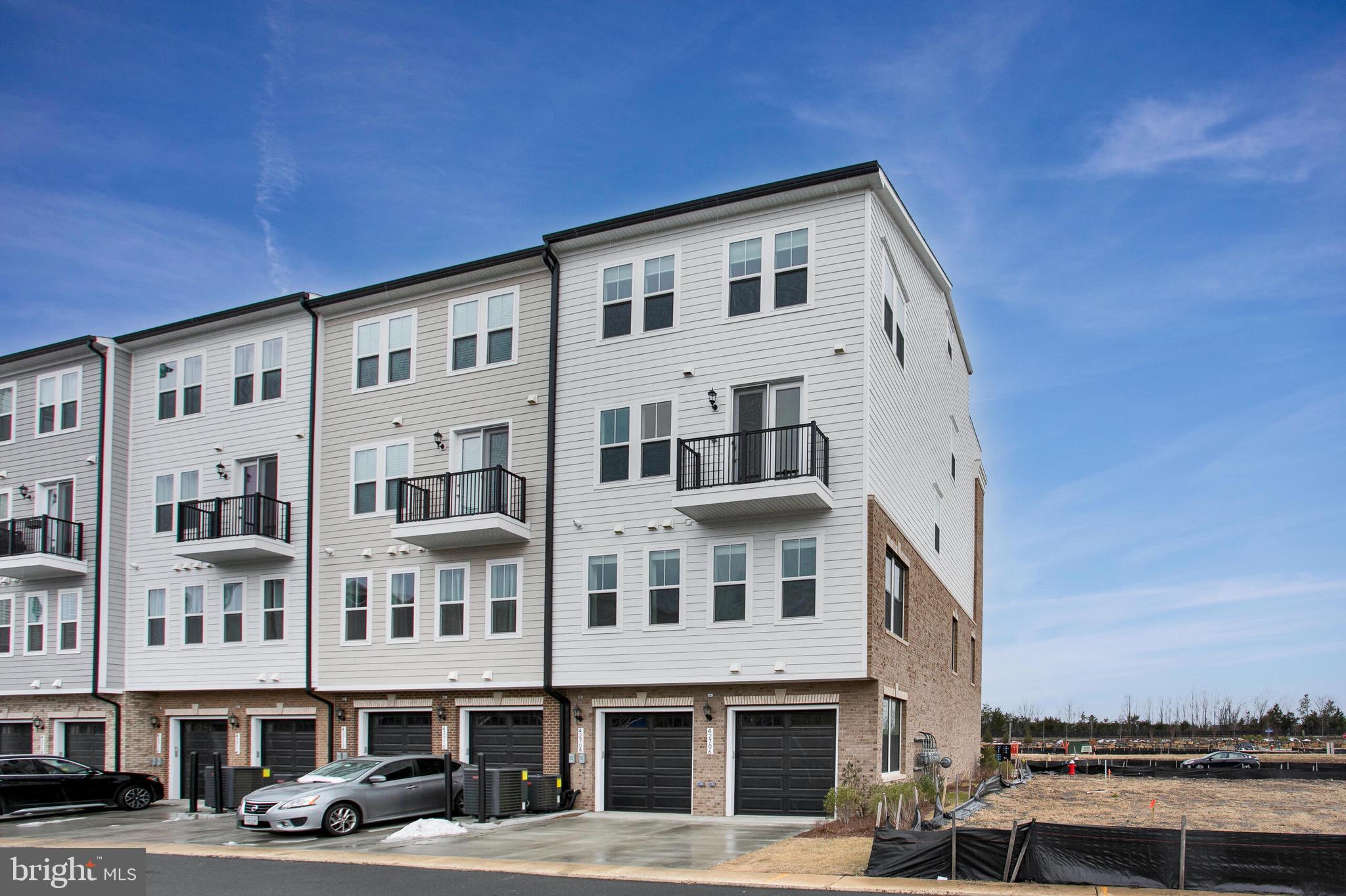 42708 Darala Drive Ashburn, VA 20147 - Photo 27 of 27 a front view of a building with lot of cars parked on road