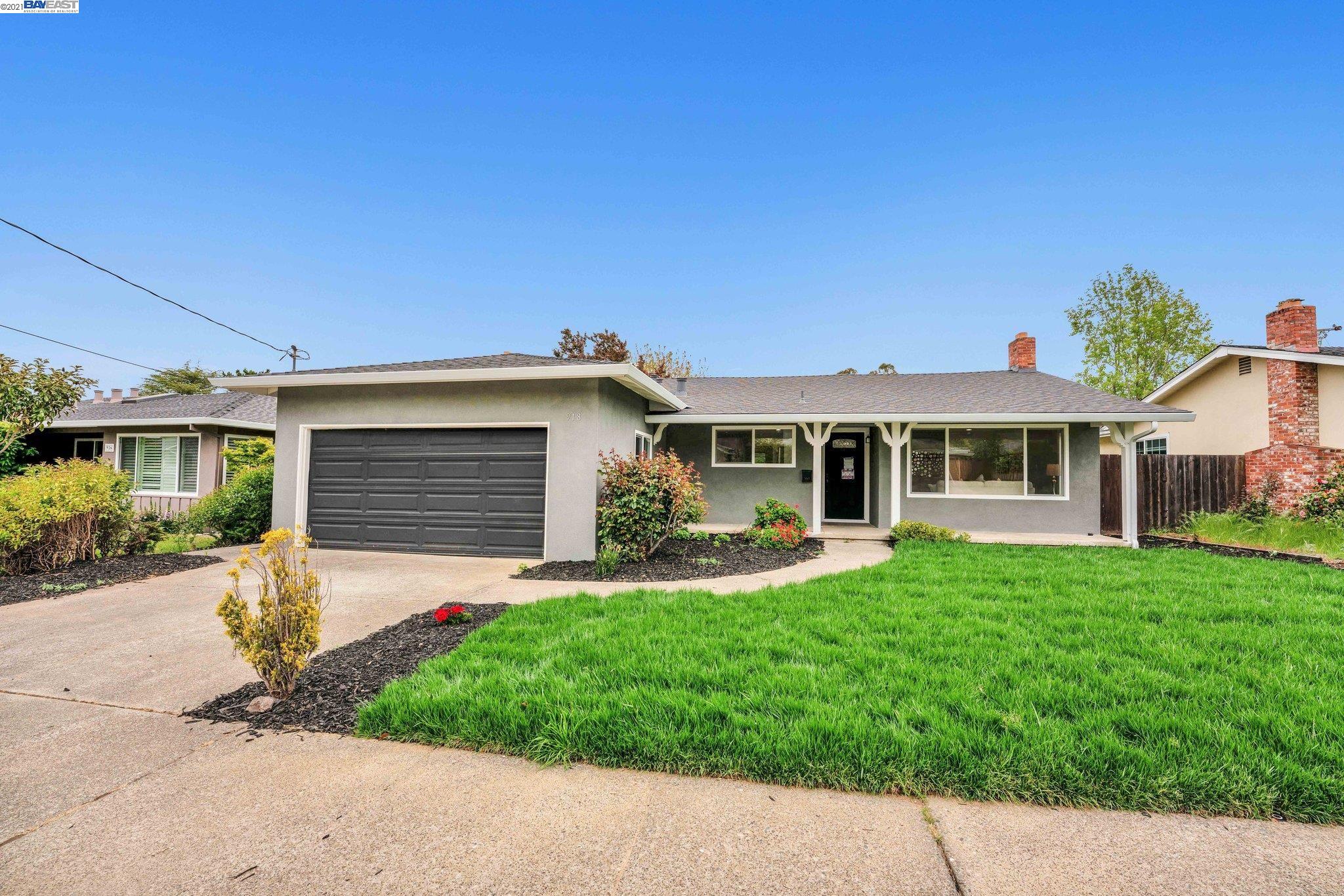 918 Las Pavadas Avenue San Rafael, CA 94903 - Photo 1 of 1 a front view of a house with a yard and porch