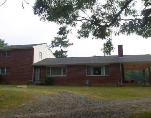 48 Shade Hollow Road Blue Ridge, VA 24064 - Photo 1 of 1 a front view of a house with a garden