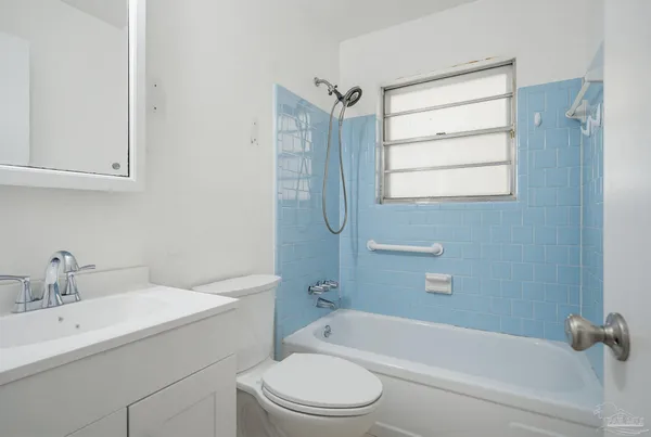 a bathroom with a sink toilet and bathtub