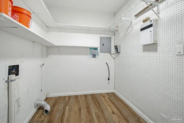 a view of a room with wooden floor