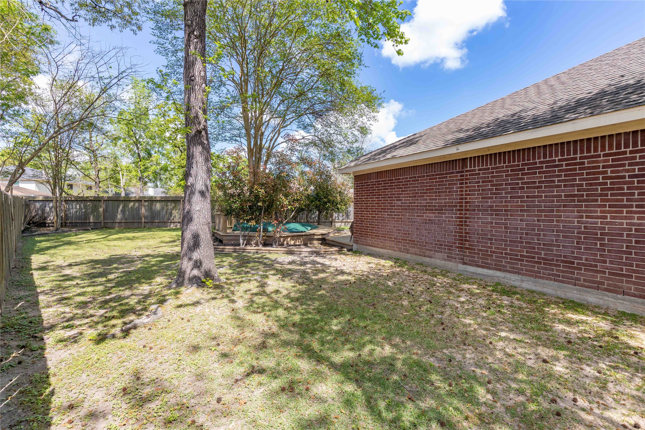 1707 Moston Drive Spring, TX 77386 - Photo 35 of 41 a view of a backyard with large trees