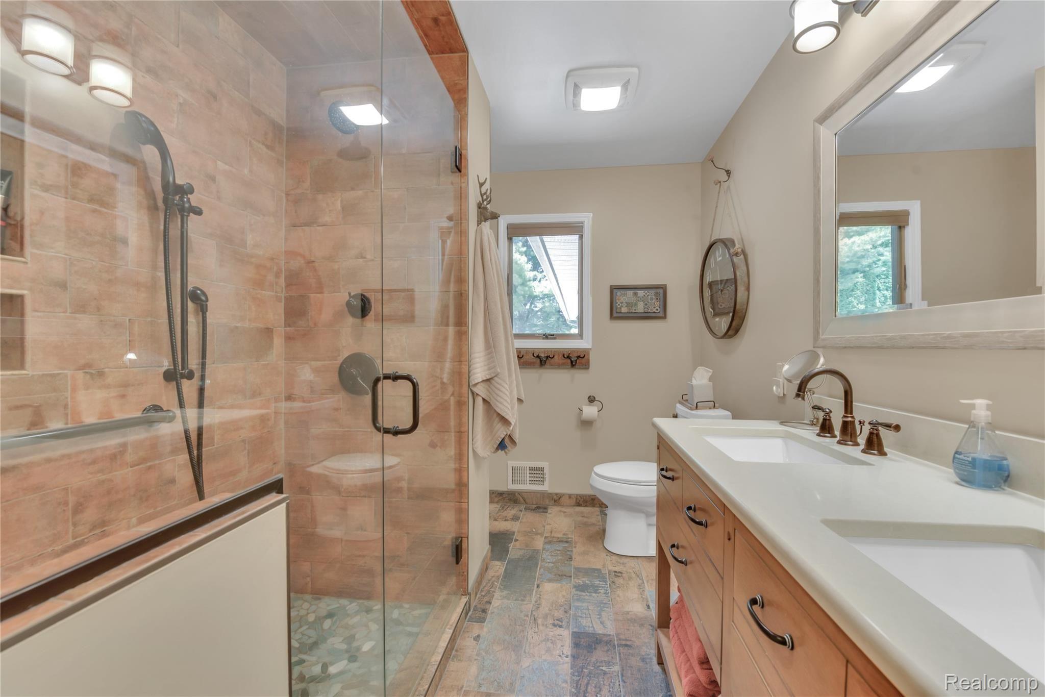 4110 Curtis Road Leonard, MI 48367 - Photo 24 of 46 amazing full bath attached to hallway by bedrooms and master bedroom. The shower is fantastic!!