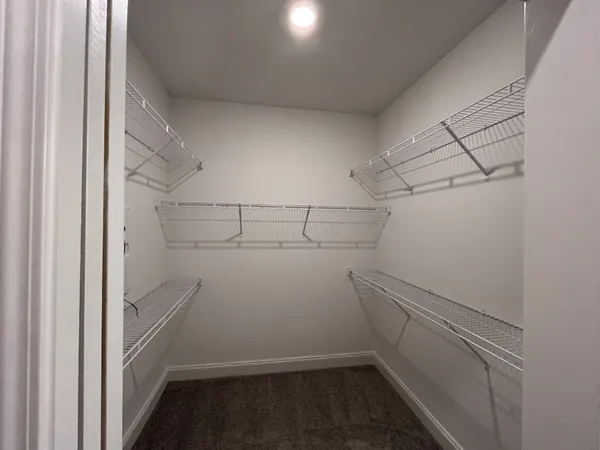 a view of storage and utility room with empty racks