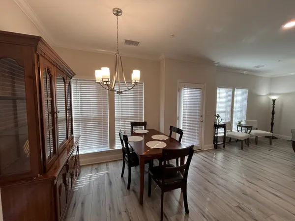 a view of a dining room with furniture and window