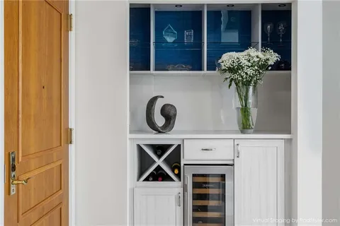 a vase of flowers sitting on a wooden door