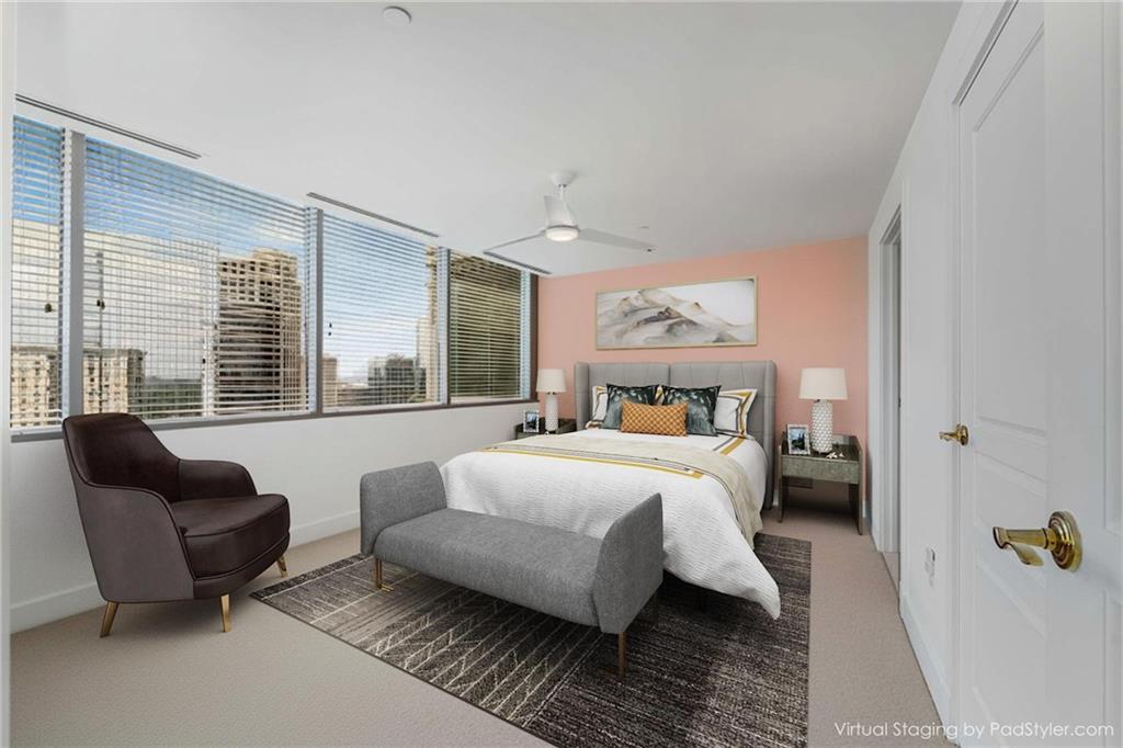 700 Park Regency Place Northeast, Unit 2201 Atlanta, GA 30326 - Photo 11 of 47 a bedroom with a bed and a couch