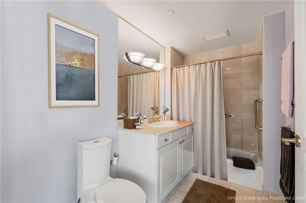 700 Park Regency Place Northeast, Unit 2201 Atlanta, GA 30326 - Photo 12 of 47 a bathroom with a sink toilet and shower