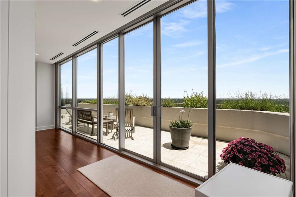 700 Park Regency Place Northeast, Unit 2201 Atlanta, GA 30326 - Photo 13 of 47 a view of a floor to ceiling window and an ocean view