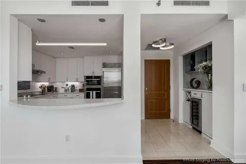 a view of a kitchen with a sink