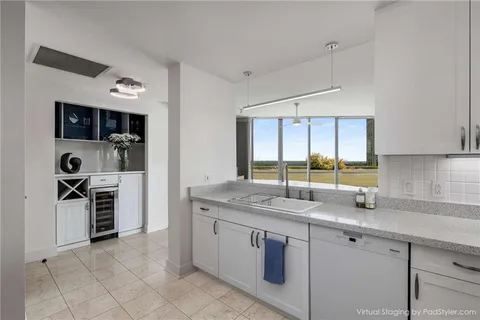a kitchen with stainless steel appliances granite countertop a sink stove oven and refrigerator