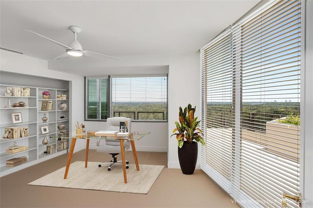 700 Park Regency Place Northeast, Unit 2201 Atlanta, GA 30326 - Photo 15 of 47 a workspace with furniture and a window