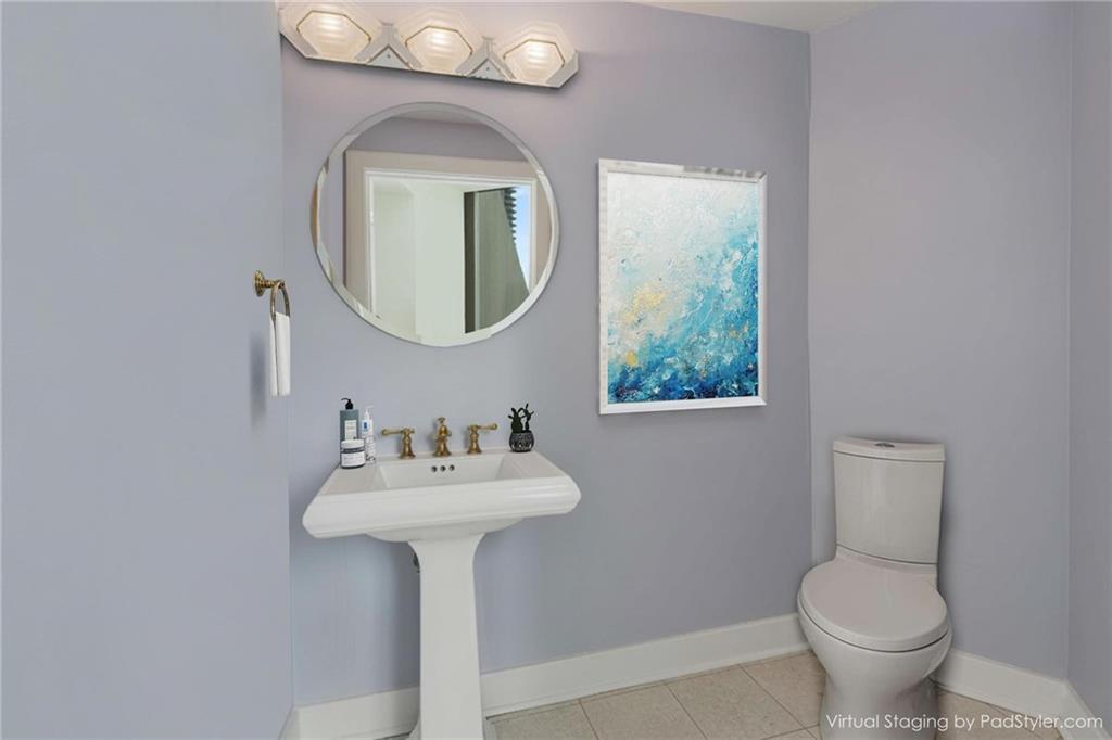 700 Park Regency Place Northeast, Unit 2201 Atlanta, GA 30326 - Photo 16 of 47 a bathroom with a toilet sink and mirror