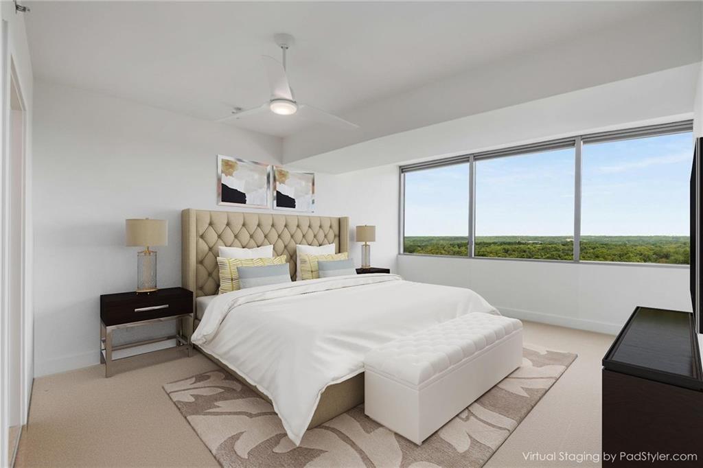 700 Park Regency Place Northeast, Unit 2201 Atlanta, GA 30326 - Photo 18 of 47 a bedroom with a large bed and a view of balcony