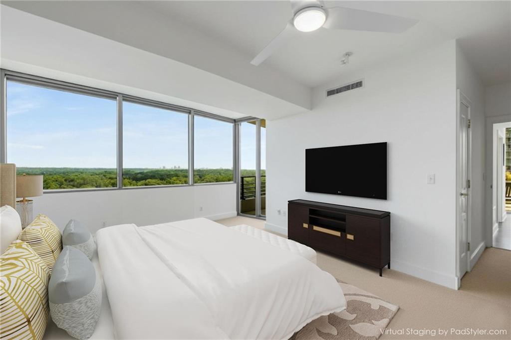 700 Park Regency Place Northeast, Unit 2201 Atlanta, GA 30326 - Photo 19 of 47 a bedroom with a bed and a television