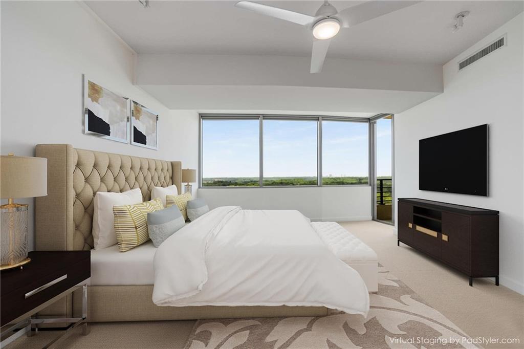 700 Park Regency Place Northeast, Unit 2201 Atlanta, GA 30326 - Photo 20 of 47 a bedroom with a bed and a flat screen tv