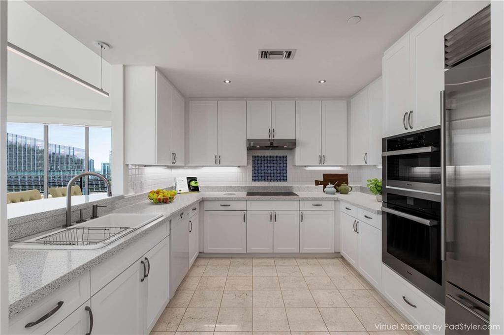 700 Park Regency Place Northeast, Unit 2201 Atlanta, GA 30326 - Photo 2 of 47 a kitchen with a sink stove and refrigerator