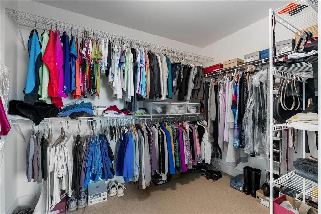 700 Park Regency Place Northeast, Unit 2201 Atlanta, GA 30326 - Photo 22 of 47 a view of walk in closet with clothes