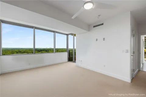a view of an empty room with a window