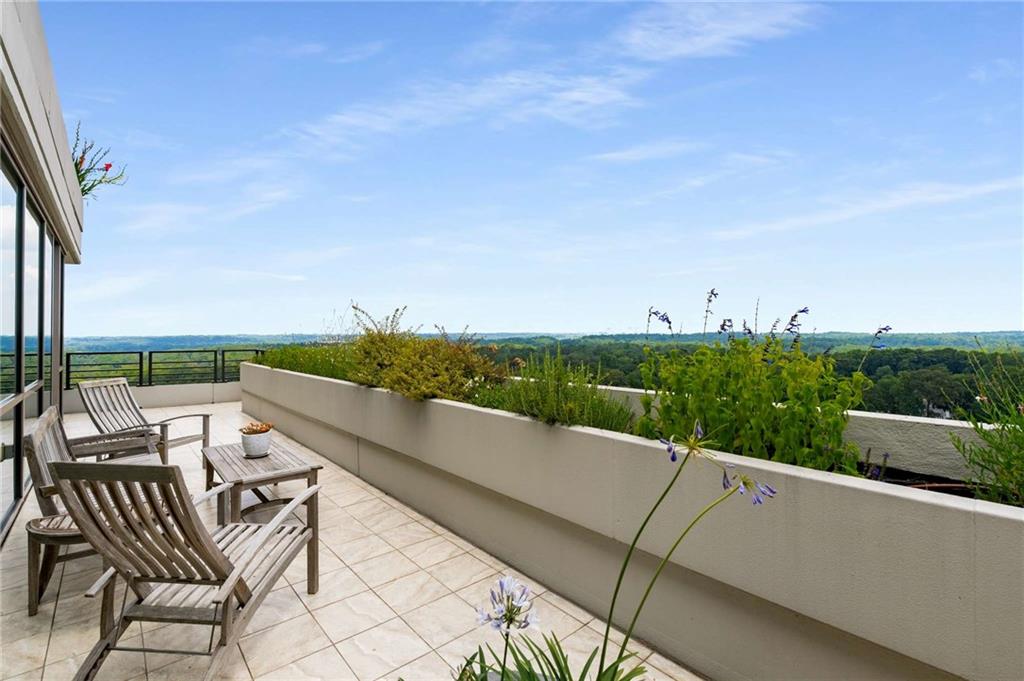 700 Park Regency Place Northeast, Unit 2201 Atlanta, GA 30326 - Photo 25 of 47 an outdoor view with patio