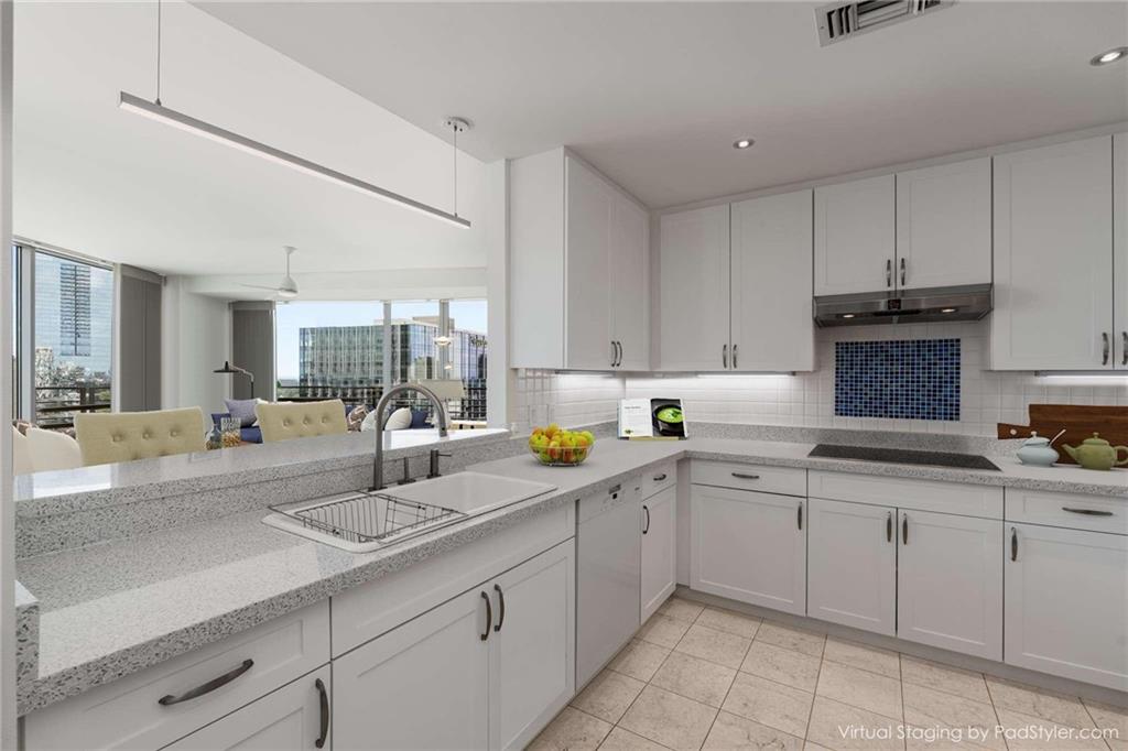 700 Park Regency Place Northeast, Unit 2201 Atlanta, GA 30326 - Photo 3 of 47 a kitchen with sink and cabinets