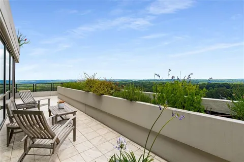 a view of a balcony with city view
