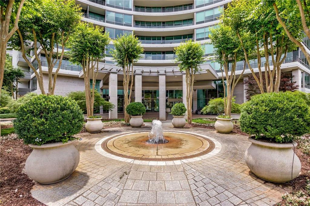 700 Park Regency Place Northeast, Unit 2201 Atlanta, GA 30326 - Photo 37 of 47 a view of a house with sitting area and garden